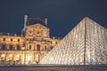 The pyramid of Louvre museum at night in summer. Royalty Free Stock Photo