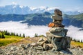 Pyramid made by stones and austrian alps in the backtound. Photo taken on Asitz moutain in Leogang Salzburg