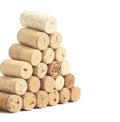 Pyramid made of used Wine corks isolated on white Royalty Free Stock Photo