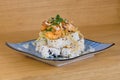 Pyramid of maki roll with fried shrimps, tempura vegetables, sesame and rocket decoration Royalty Free Stock Photo