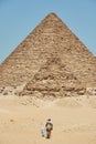 The Pyramid of Menkaure and one of QueenÃ¢â¬â¢s pyramid on Giza Plateau