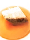 Pyramid mesh teabag in a cup close up Royalty Free Stock Photo