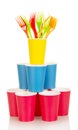 Pyramid from multi-colored disposable cups and plastic forks isolated.. Royalty Free Stock Photo