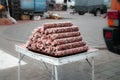 Pyramid of natural homemade sausages on the counter of the village market. Natural food Royalty Free Stock Photo