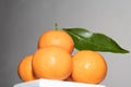 Orange pyramid with green leaves, drying.