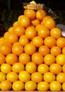 Pyramid of oranges in store front display