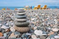 The pyramid of pebbles on the beach. Pyramid of stones lying on sea coast Royalty Free Stock Photo