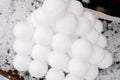 pyramid or a pile of perfect snowballs on frosty winter day in forest or garden outdoor