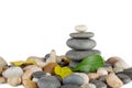 Pyramid of the round sea stones with leaves Royalty Free Stock Photo