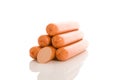 Pyramid of sausages on white. Royalty Free Stock Photo