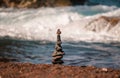 Pyramid of sea pebbles on beach. Life balance and harmony concept. Balancing nature. Royalty Free Stock Photo