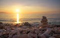 Pyramid of the small pebbles on the beach. Stones, against the background of the sea shore Royalty Free Stock Photo