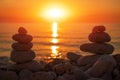 Pyramid of the small pebbles on the beach. Stones, against the background of the sea shore during sunset Royalty Free Stock Photo