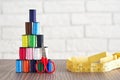 Pyramid of spools of multi-colored sewing threads, scissors, measuring tape Royalty Free Stock Photo