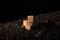 A pyramid of square pieces of unrefined cane sugar, standing on tea. Royalty Free Stock Photo