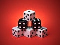 Pyramid Stacked Playing Dice on Red Background