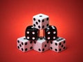Pyramid Stacked Playing Dice on Red Background Royalty Free Stock Photo