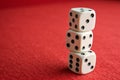 Pyramid Stacked Playing Dice on Red Background Royalty Free Stock Photo