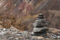 A pyramid of stone on top of a mountain on the background of mountains for meditation. Harmony. Royalty Free Stock Photo