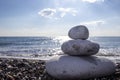 Pyramid stones balance on the sand of the beach Royalty Free Stock Photo