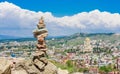 Pyramid of stones and panoramic view of Tbilisi city. Georgia