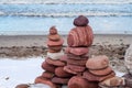 A pyramid of stones. The sea stones are stacked beautifully. Zen and peaceful on the seashore Royalty Free Stock Photo