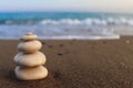 Pyramid of stones on the seashore. Zen concept. Concept of harmony, stability, life balance, relaxation and meditation. Blurred Royalty Free Stock Photo