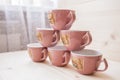 Pyramid of tea mugs side view Royalty Free Stock Photo