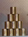 Pyramid of ten tin cans without banderole, which are put together at the fair to form a pyramid to be folded over. Royalty Free Stock Photo