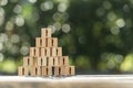 Pyramid of toy wooden blocks with human icons Royalty Free Stock Photo