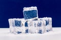 Ice cubes in close-up on blue and white background Royalty Free Stock Photo