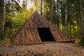 Pyramid of Wishes. Wooden pyramid in the mysterious Pokaini Forest near Dobele, Latvia during cloudy autumn day