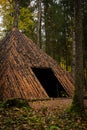 Pyramid of Wishes. Wooden pyramid in the mysterious Pokaini Forest near Dobele, Latvia during cloudy autumn day