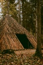 Pyramid of Wishes. Wooden pyramid in the mysterious Pokaini Forest near Dobele, Latvia during cloudy autumn day