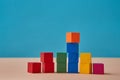 Pyramid of wooden multi colorful cubes mockup, copy space. Career ladder. Business growth, development. Place for tex