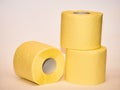 pyramid of yellow toilet paper isolated over white background Royalty Free Stock Photo