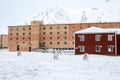 Pyramiden, Norway - August 2017: Reindeer searching for food in front of the old abandoned buildings in Pyramiden in