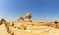 Pyramids of Giza panorama, view on the Sphinx, the Pyramid of Cheops and the Pyramid of Chephren Royalty Free Stock Photo