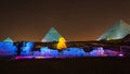 The Pyramids of Giza and the Sphynx iluminated at night - Cairo, Egypt