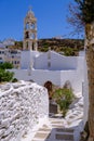 Church, whitewashed houses and arid landscape on Tinos Island