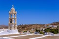 Church, whitewashed houses and arid landscape on Tinos Island