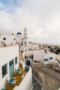 PYRGOS, GREECE - MAY 2018: View of orthodox church and bell tower in Pyrgos town center, Santorini island, Greece