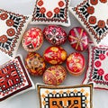Pysanky Ukrainian Easter Eggs with embroidered pillows colorful patterns floral