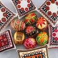 Pysanky Ukrainian Easter Eggs on white with embroidered pillows various designs