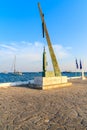 PYTHAGORION PORT, SAMOS ISLAND - SEP 18, 2015: statue in Pythagorion port at sunset time, Samos island, Greece Royalty Free Stock Photo