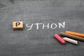 Python code and programming language concept. Colored chalk pieces on a black chalk board Royalty Free Stock Photo
