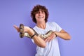 python snake coiling around mans hand