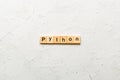python word written on wood block. python text on table, concept Royalty Free Stock Photo