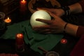 Pythoness reading the future in her hand on a crystal ball