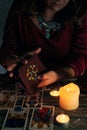 Pythoness woman shuffles tarot cards Royalty Free Stock Photo